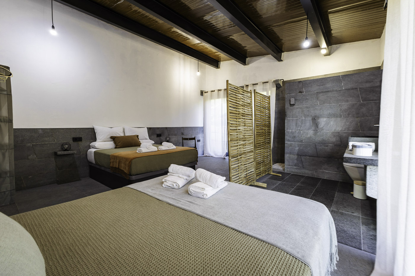 En suite facilities are open plan in all bedrooms